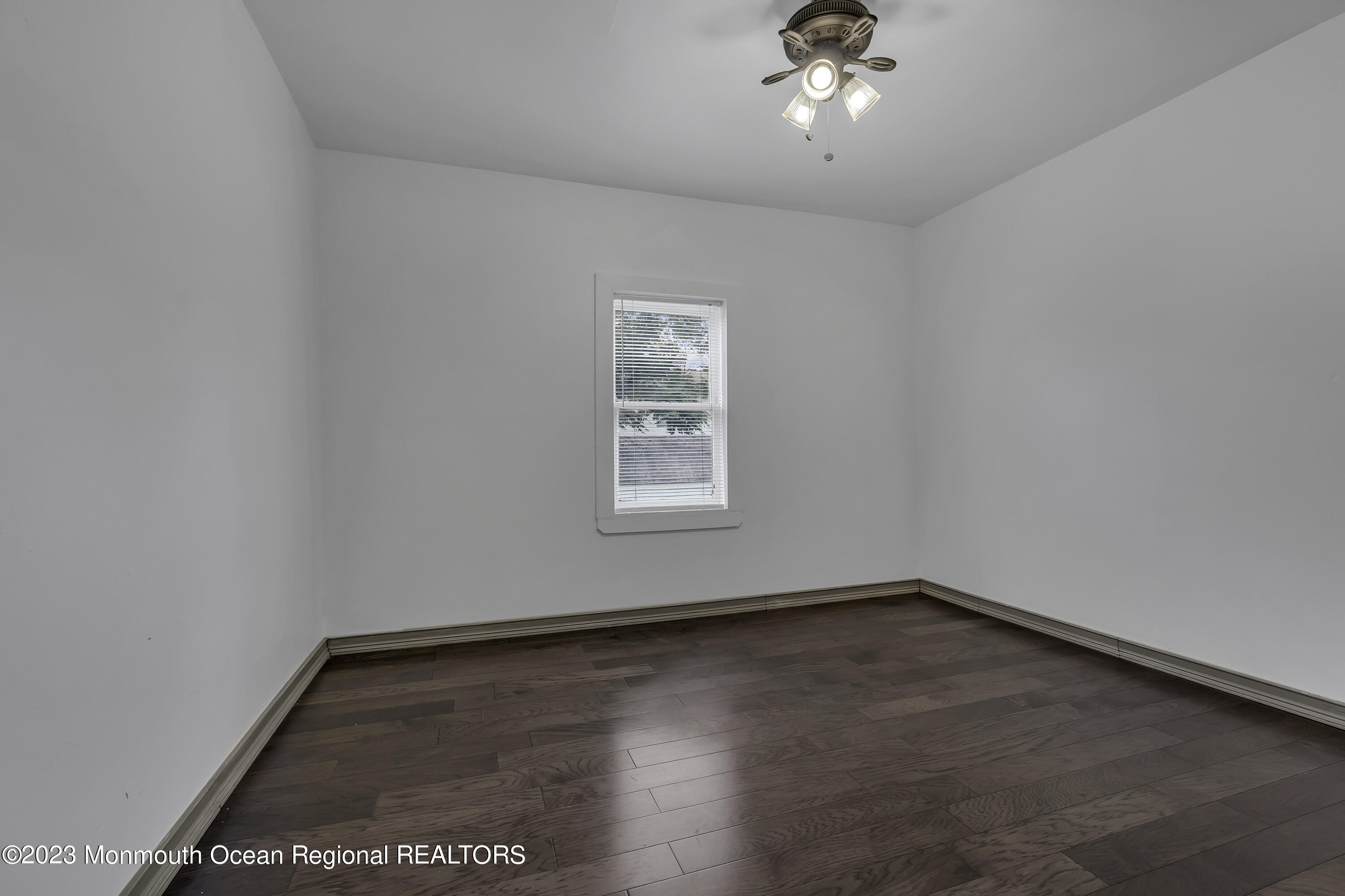 237 Broadway Union Beach, NJ 07735 - Photo 15 of 23 a view of a big room with wooden floor and windows
