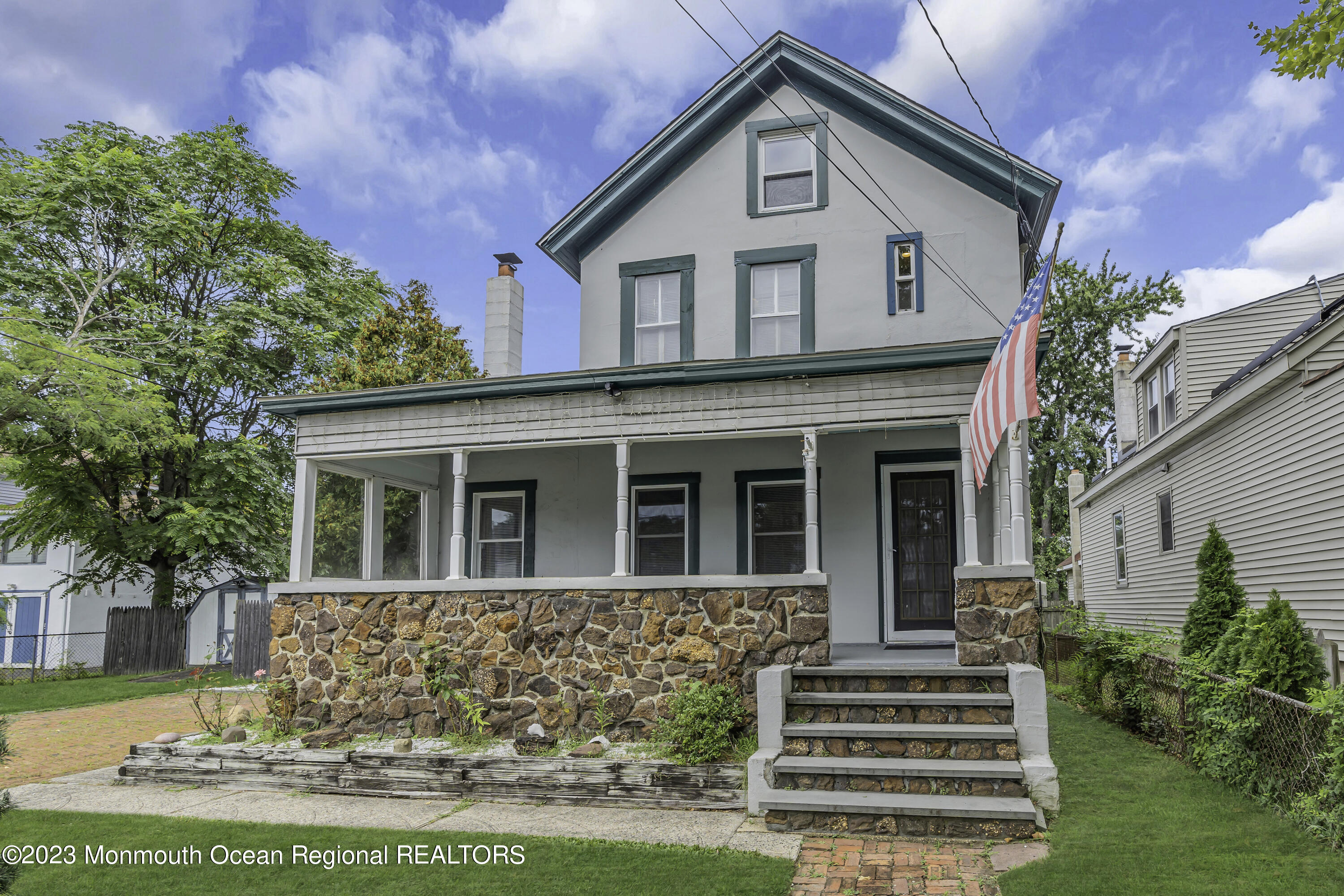237 Broadway Union Beach, NJ 07735 - Photo 2 of 23 a front view of a house with a yard