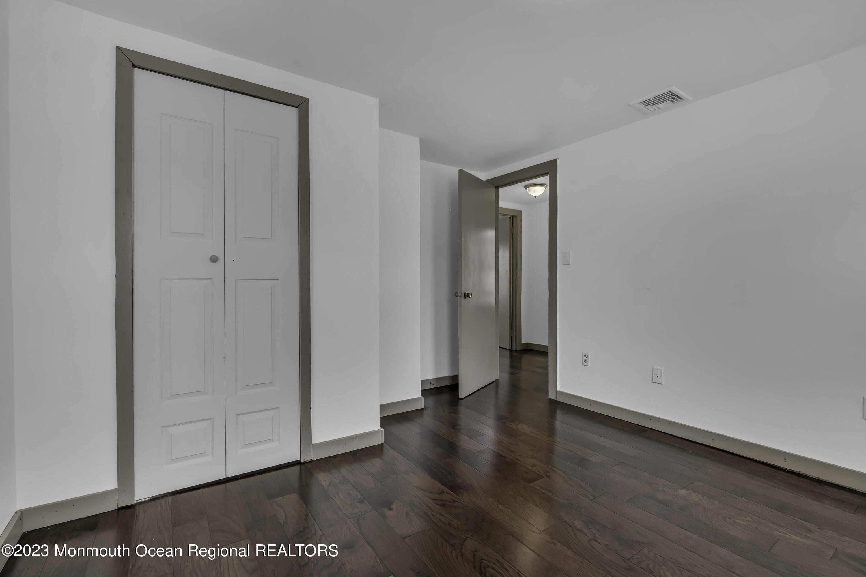 237 Broadway Union Beach, NJ 07735 - Photo 21 of 23 a view of an empty room with wooden floor