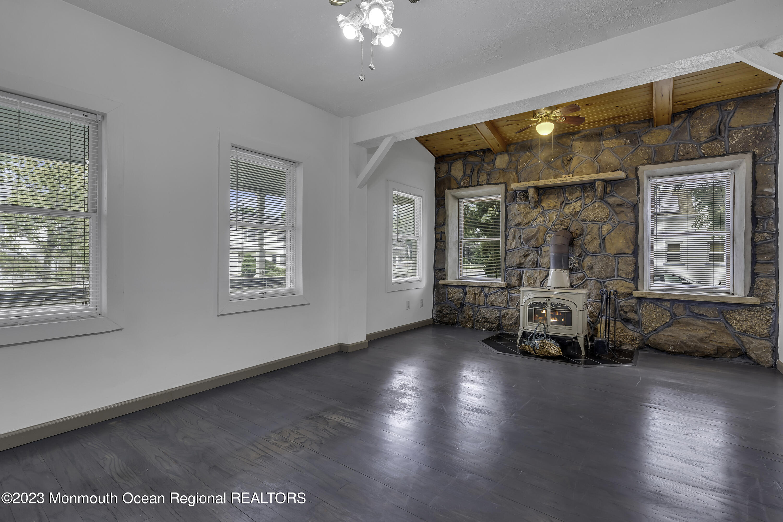 237 Broadway Union Beach, NJ 07735 - Photo 6 of 23 a view of a room with wooden floor and furniture