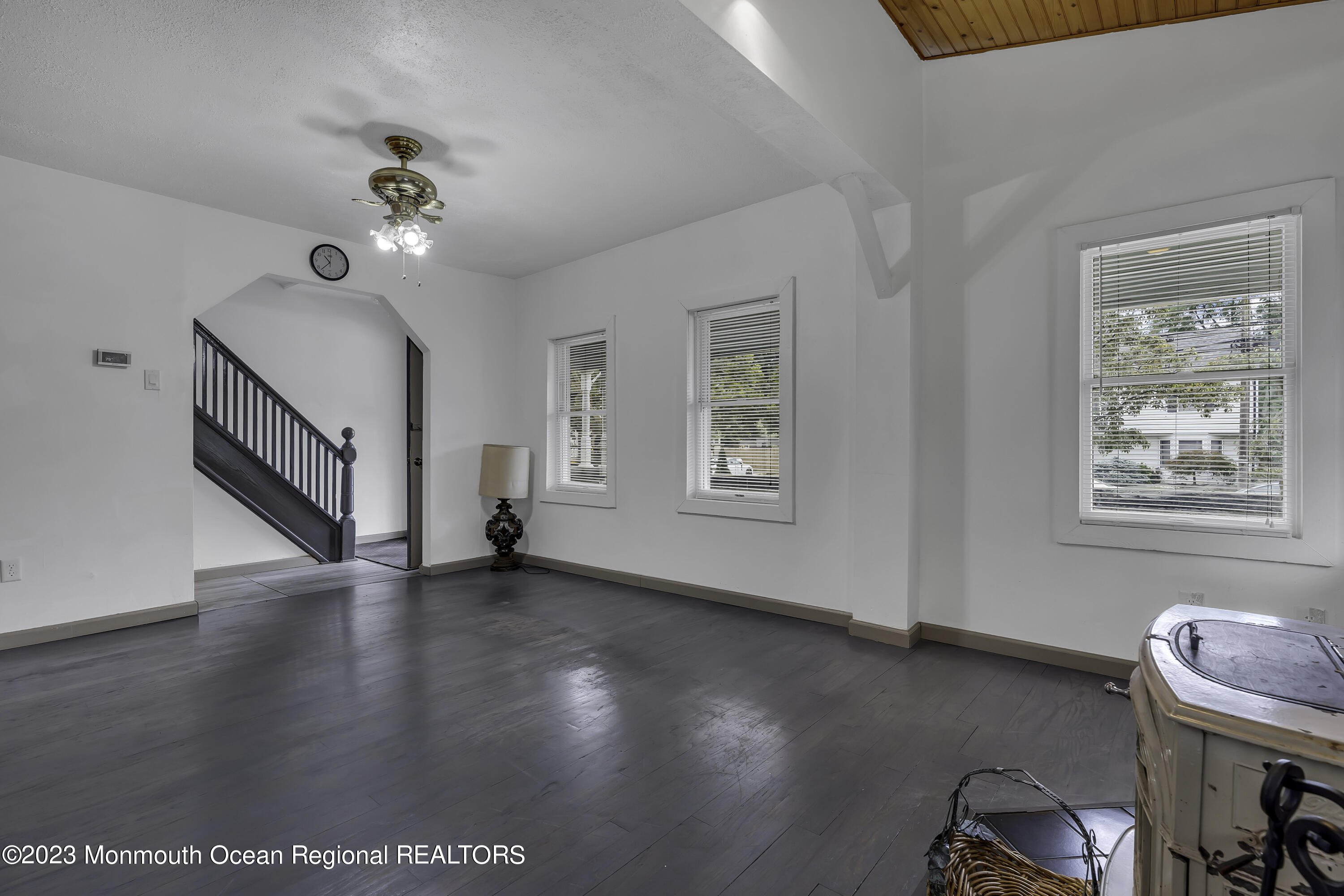 237 Broadway Union Beach, NJ 07735 - Photo 8 of 23 a view of an empty room with wooden floor and a window