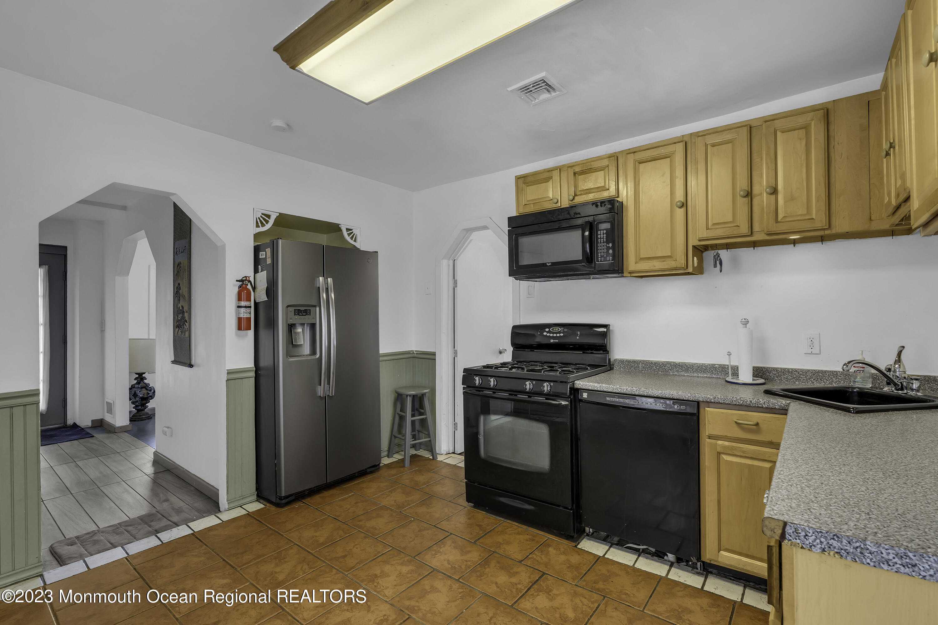 237 Broadway Union Beach, NJ 07735 - Photo 9 of 23 a kitchen with stainless steel appliances granite countertop a stove a refrigerator and a sink