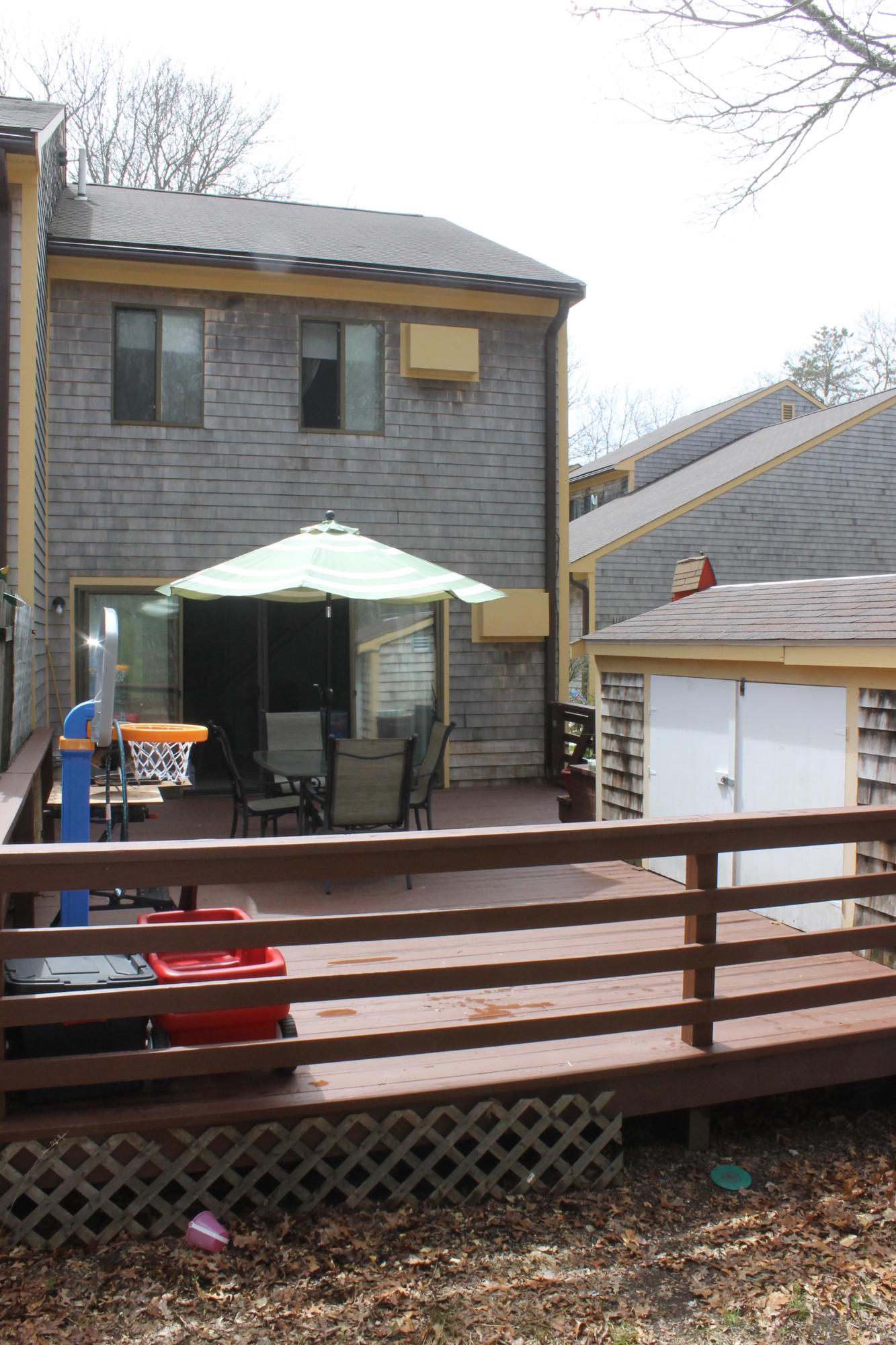 26 Round House Road, Unit 26 Bourne, MA 02532 - Photo 18 of 25 a front view of a house with a yard