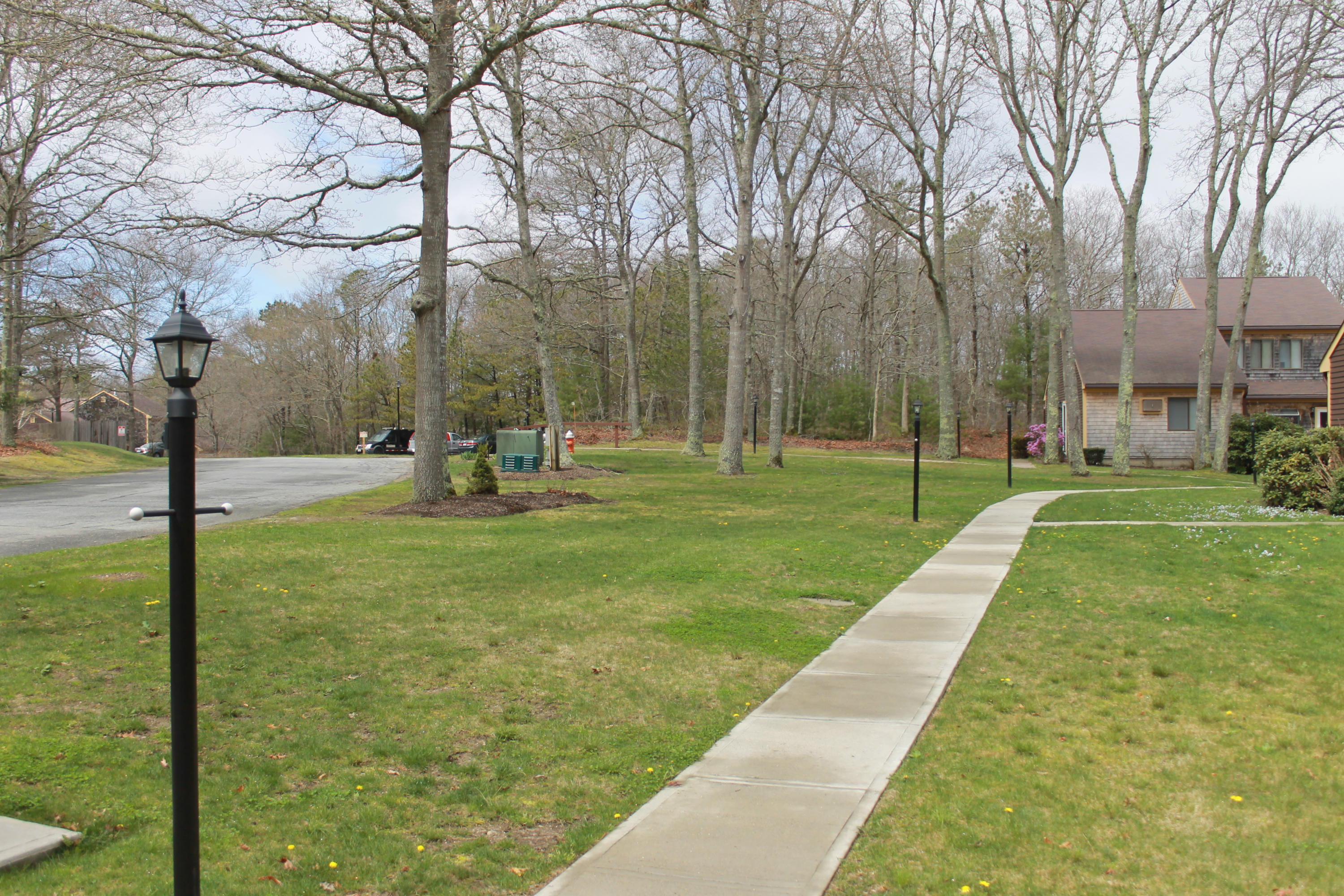 26 Round House Road, Unit 26 Bourne, MA 02532 - Photo 23 of 25 a garden with trees in the background