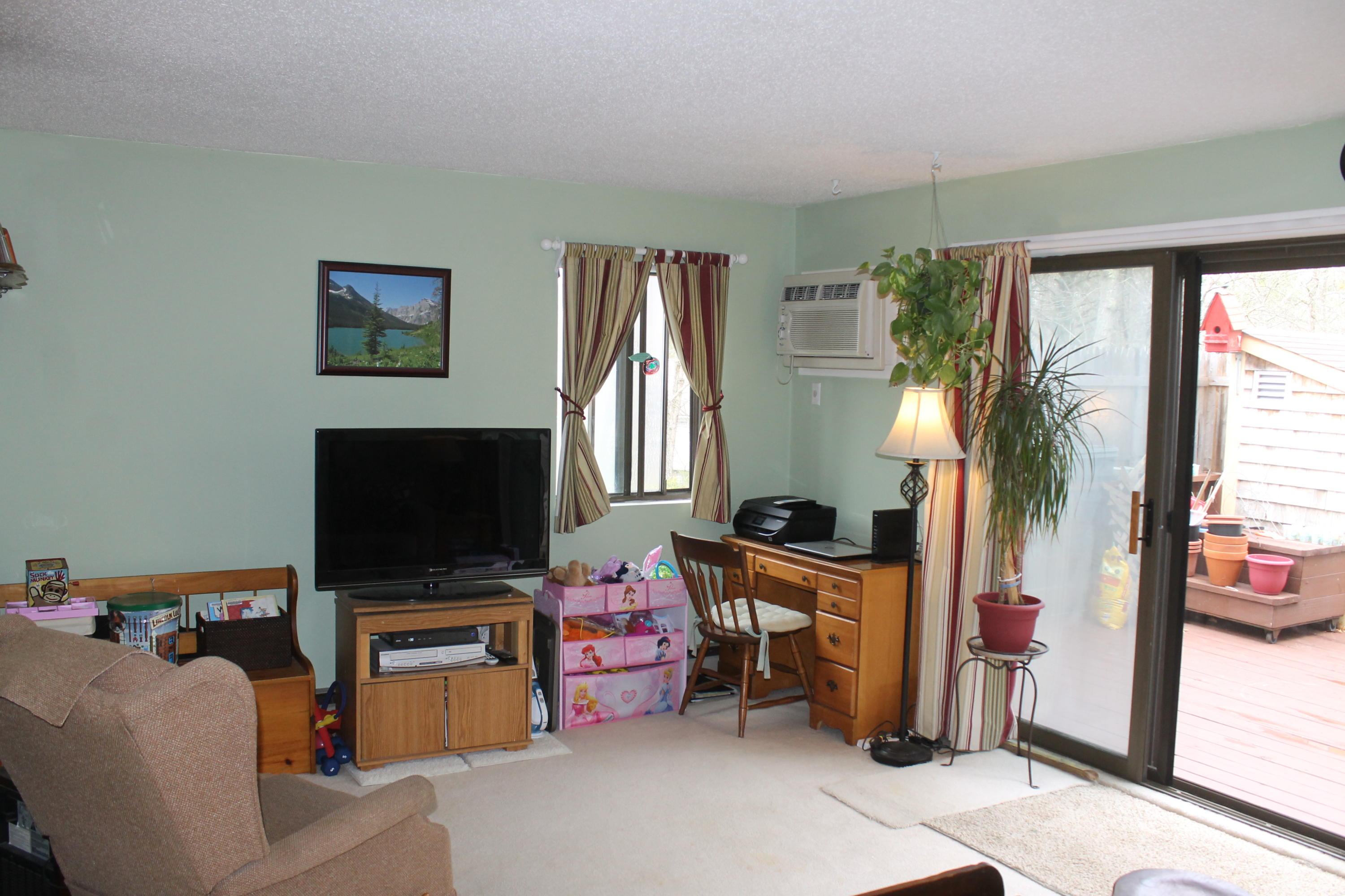 26 Round House Road, Unit 26 Bourne, MA 02532 - Photo 6 of 25 a livingroom with furniture and a flat screen tv
