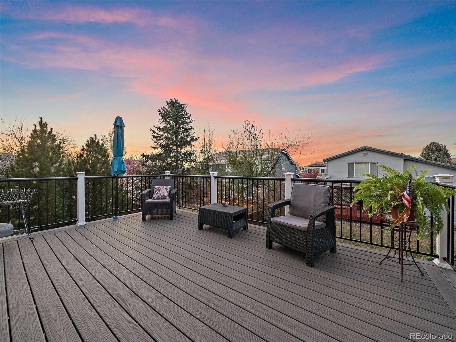 6523 Shannon Trail Highlands Ranch, CO 80130 - Photo 15 of 38 a view of a roof deck with wooden floor and fence