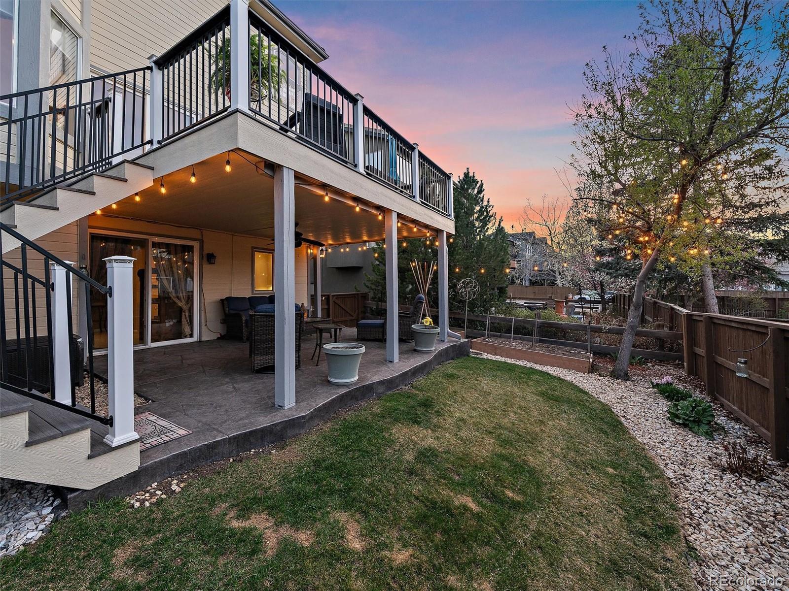 6523 Shannon Trail Highlands Ranch, CO 80130 - Photo 17 of 38 a view of a house with backyard porch and sitting area