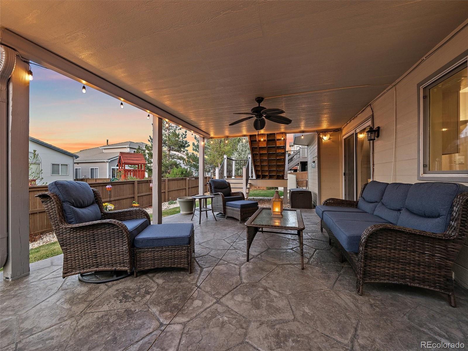 6523 Shannon Trail Highlands Ranch, CO 80130 - Photo 18 of 38 a outdoor living space with patio furniture and a potted plant