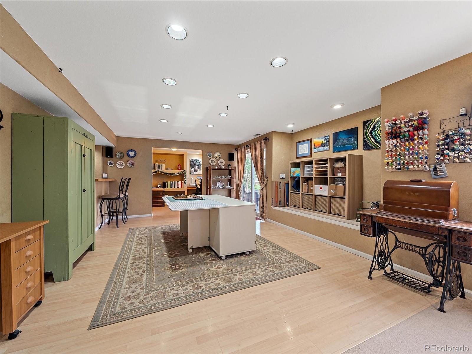 6523 Shannon Trail Highlands Ranch, CO 80130 - Photo 30 of 38 a living room with furniture and a flat screen tv