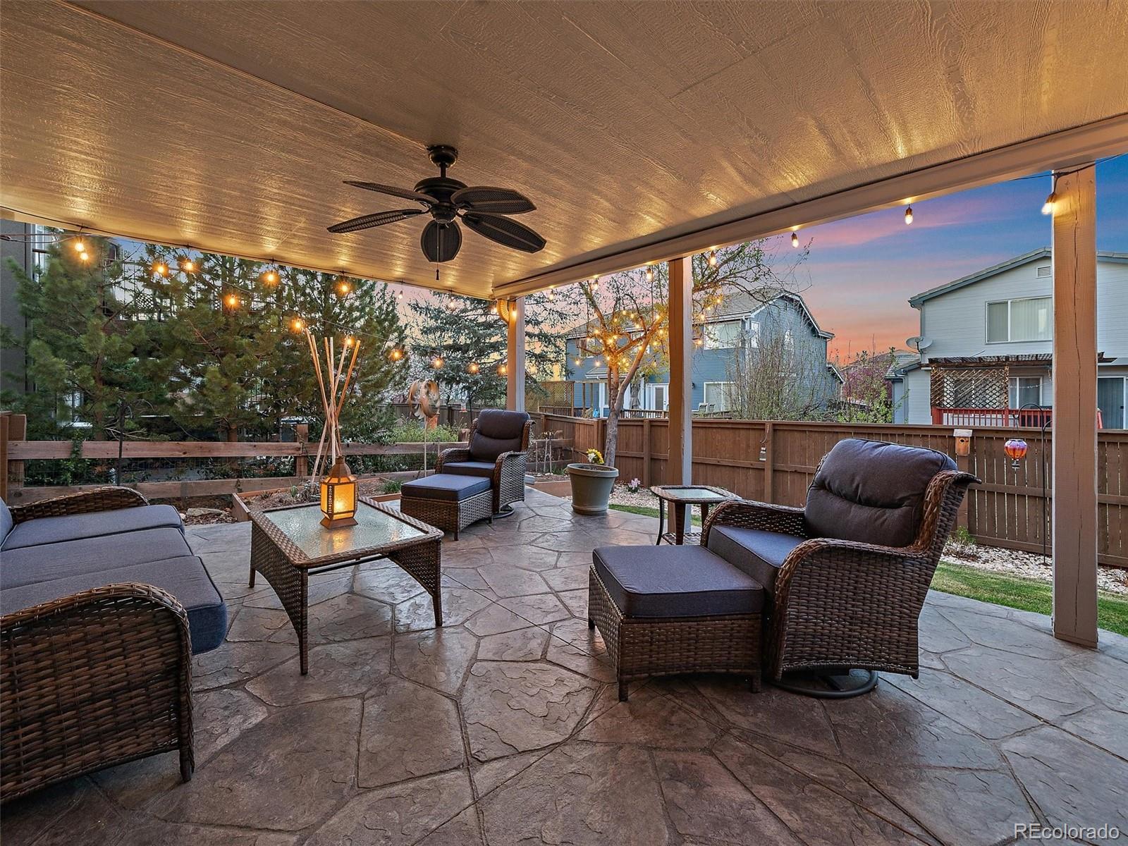 6523 Shannon Trail Highlands Ranch, CO 80130 - Photo 31 of 38 a living room with patio furniture and a potted plant