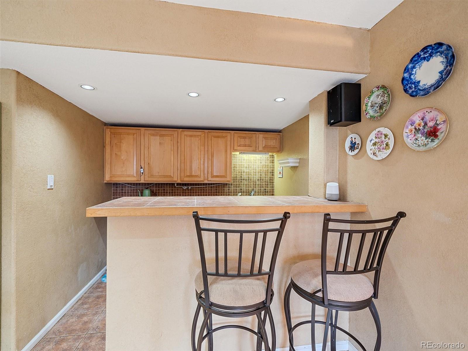 6523 Shannon Trail Highlands Ranch, CO 80130 - Photo 33 of 38 a view of a dining room with furniture one side and wooden floor