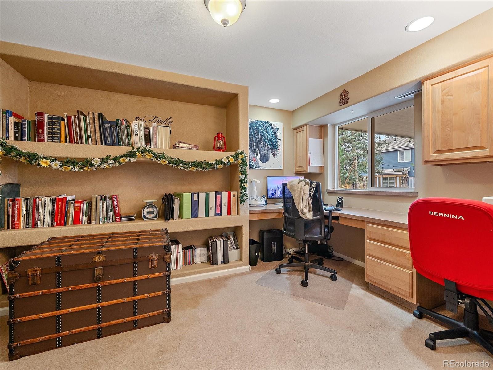 6523 Shannon Trail Highlands Ranch, CO 80130 - Photo 34 of 38 a view of a workspace with furniture and a window