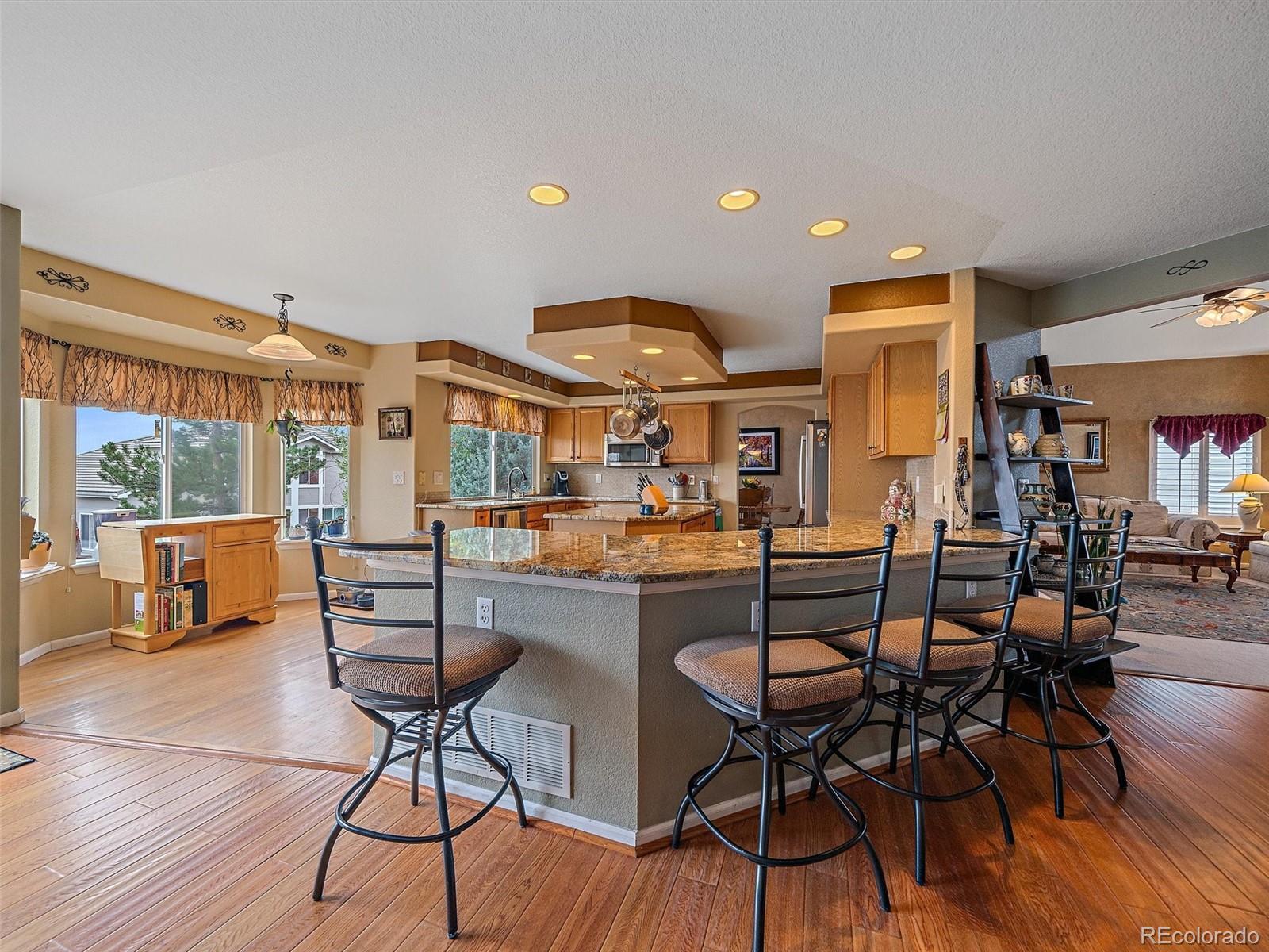 6523 Shannon Trail Highlands Ranch, CO 80130 - Photo 7 of 38 a view of a dining room with furniture window and outside view