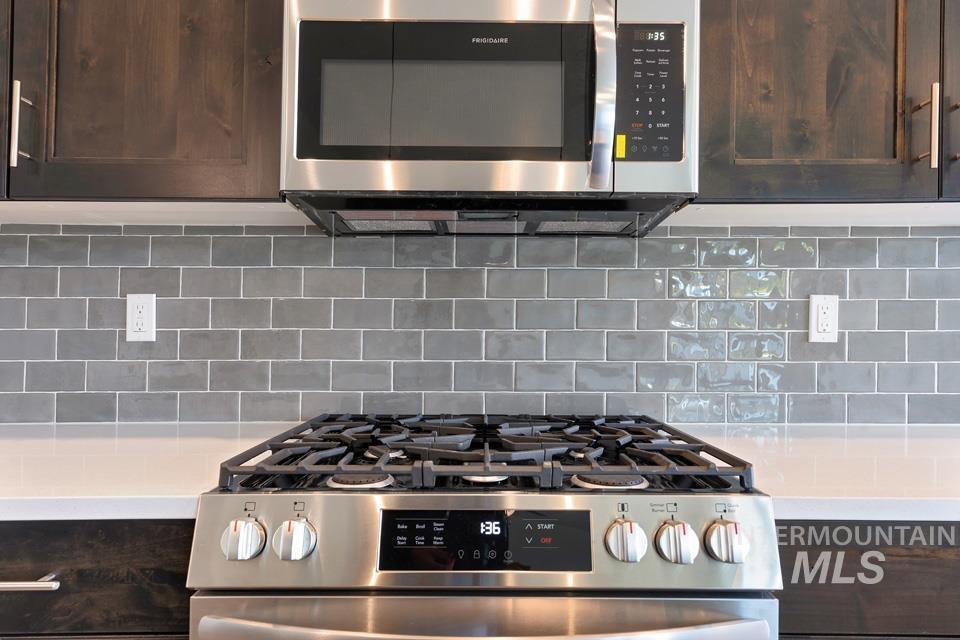 1340 Dawn Street Weiser, ID 83672 - Photo 10 of 32 Kitchen view of stainless steel appliances and dark brown cabinets