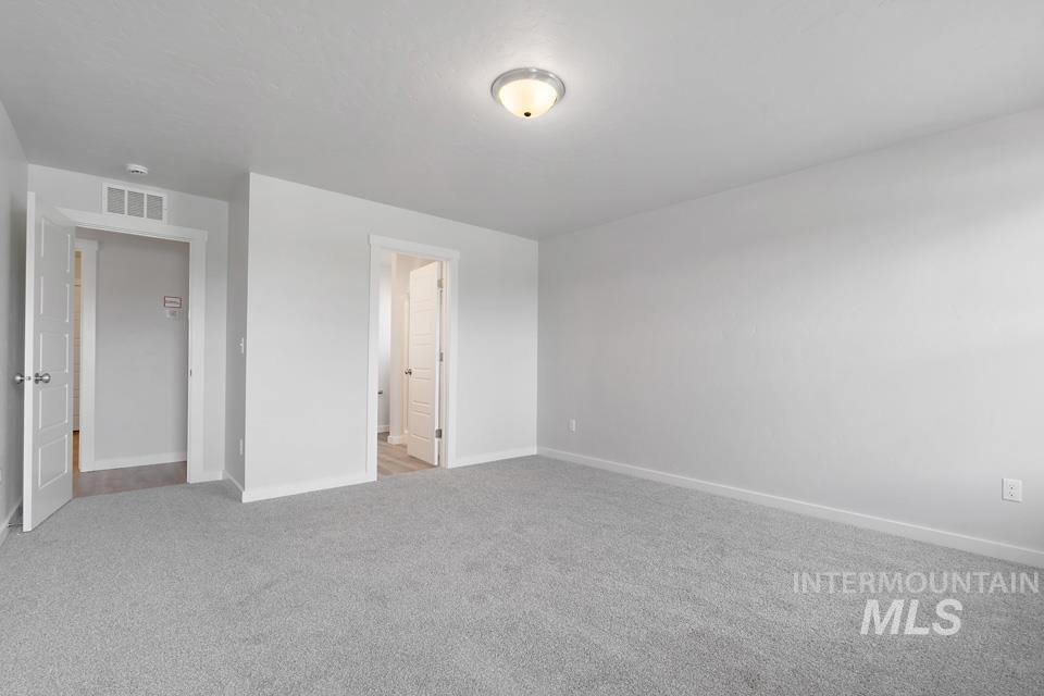 1340 Dawn Street Weiser, ID 83672 - Photo 15 of 32 Unfurnished bedroom with baseboards and carpet floors