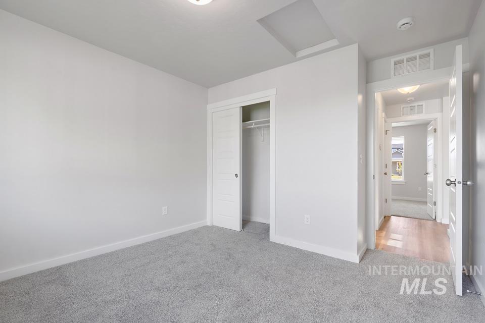 1340 Dawn Street Weiser, ID 83672 - Photo 27 of 32 Unfurnished bedroom featuring carpet and a closet