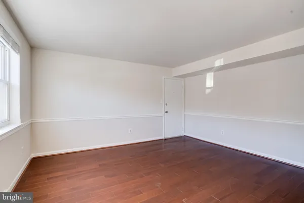 an empty room with a empty space and window