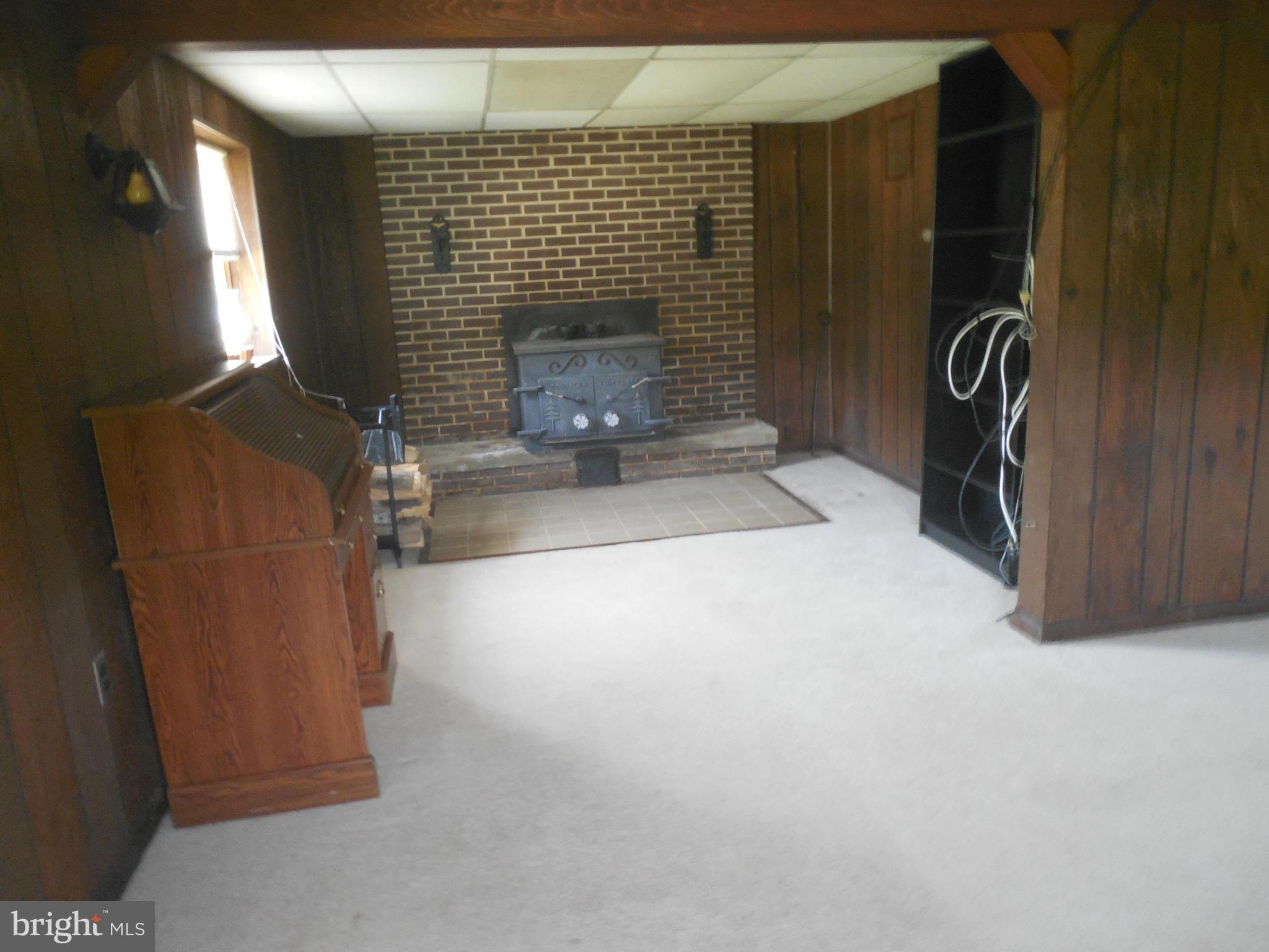 15057 New Windsor Road New Windsor, MD 21776 - Photo 16 of 30 Fireplace with woodstove insert