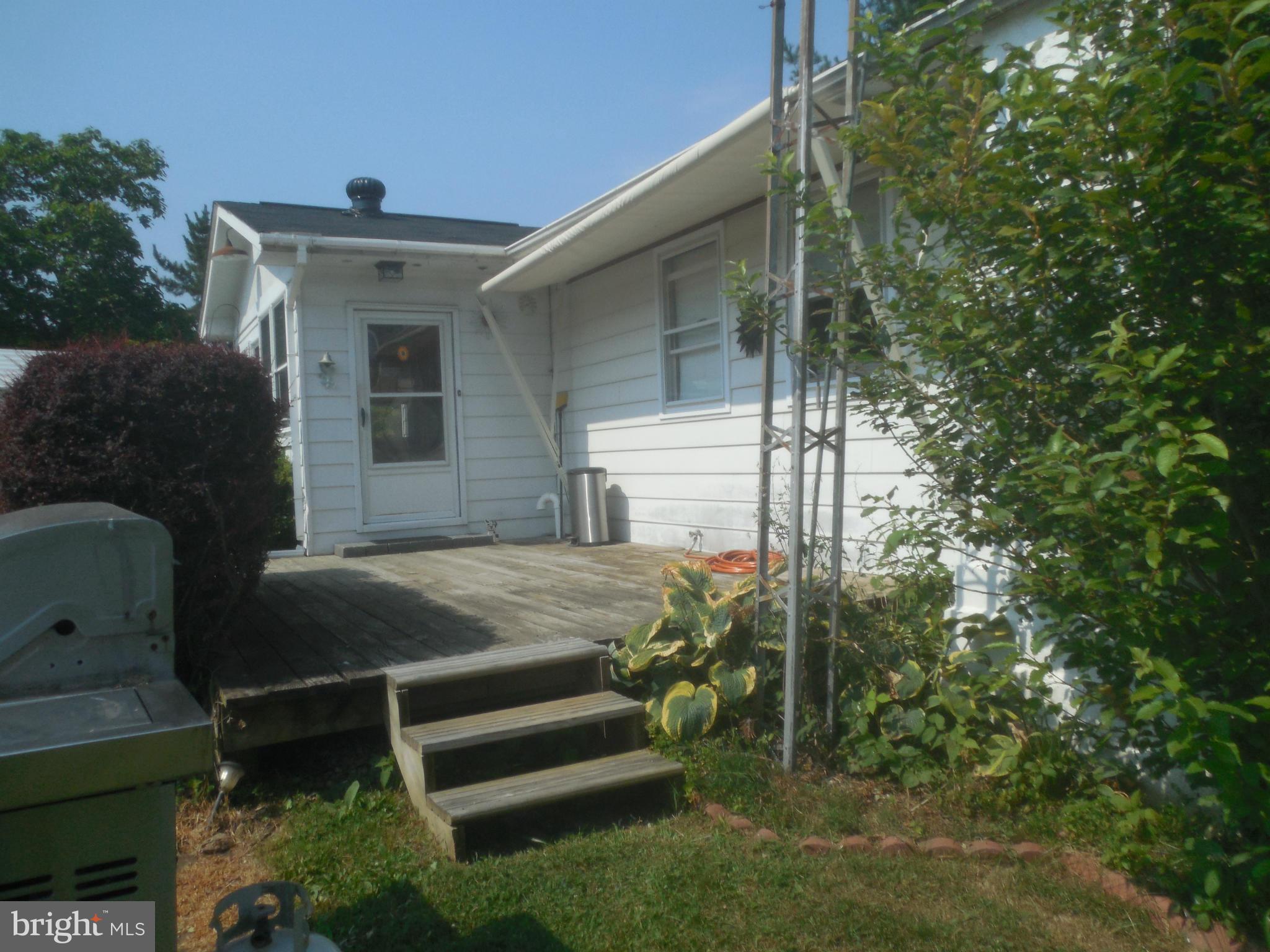 15057 New Windsor Road New Windsor, MD 21776 - Photo 22 of 30 Deck with retractable awning