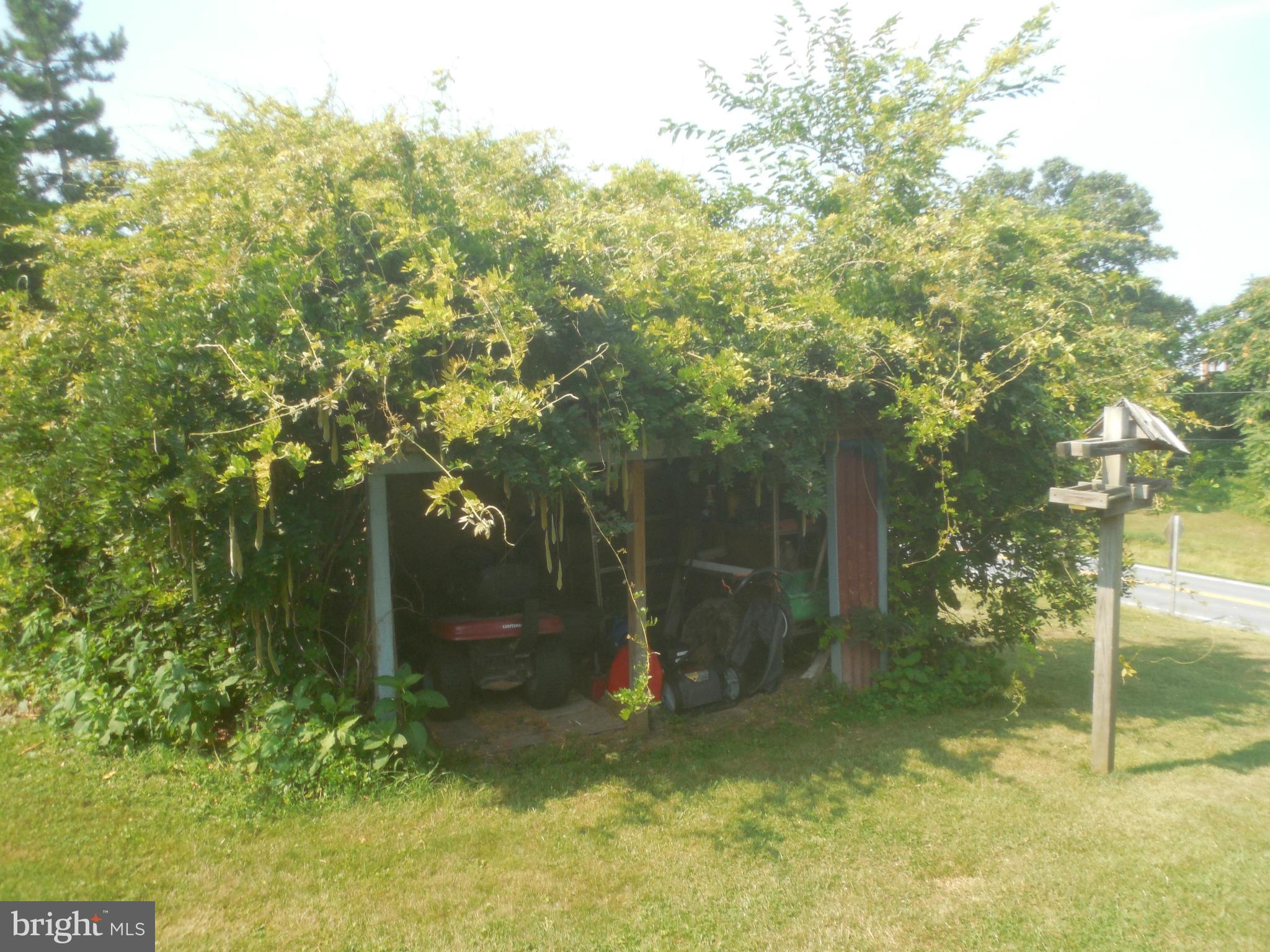 15057 New Windsor Road New Windsor, MD 21776 - Photo 25 of 30 Machine shed with wisteria cover