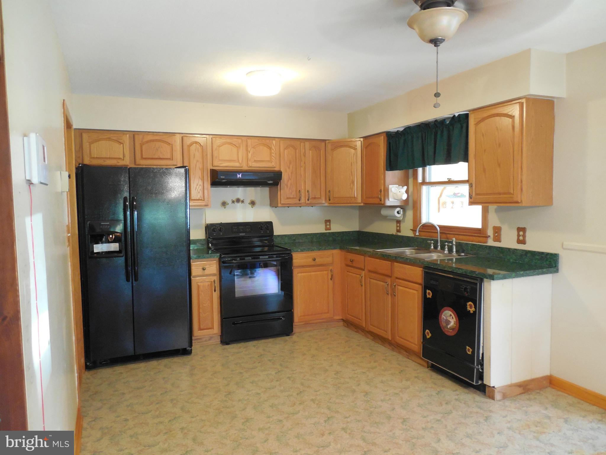 15057 New Windsor Road New Windsor, MD 21776 - Photo 6 of 30 Kitchen has new refrigerator and range