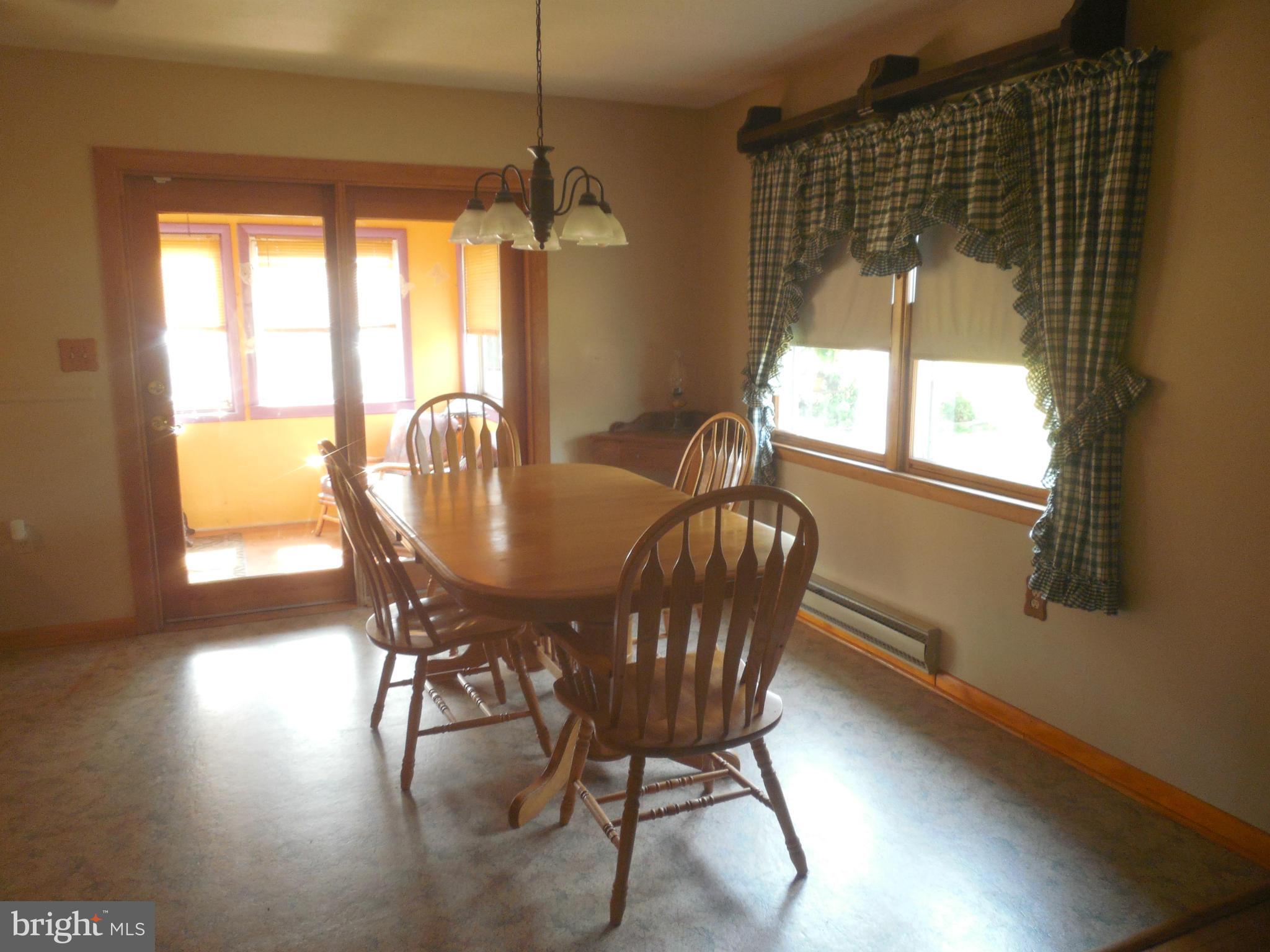 15057 New Windsor Road New Windsor, MD 21776 - Photo 7 of 30 Dining Room with doorway to sun porch