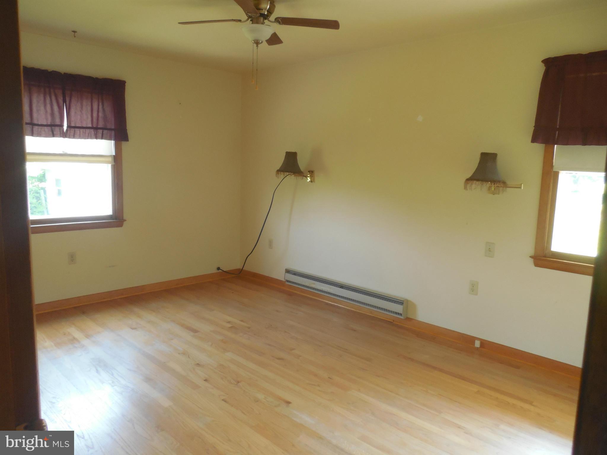 15057 New Windsor Road New Windsor, MD 21776 - Photo 8 of 30 Bedroom has hardwood floors and scounces
