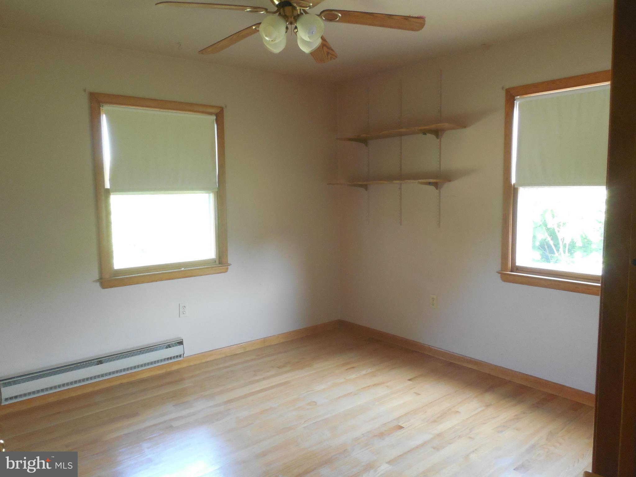 15057 New Windsor Road New Windsor, MD 21776 - Photo 10 of 30 Second bedroom has hardwood floors, window a/c