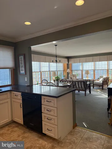 a kitchen with stainless steel appliances granite countertop a stove and cabinets