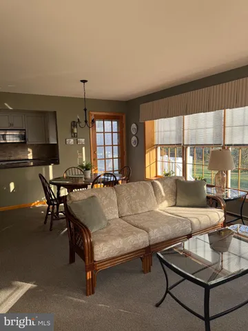 a living room with furniture and a table
