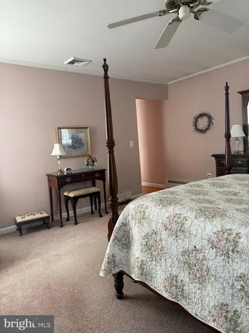 a bedroom with a bed and a table in it