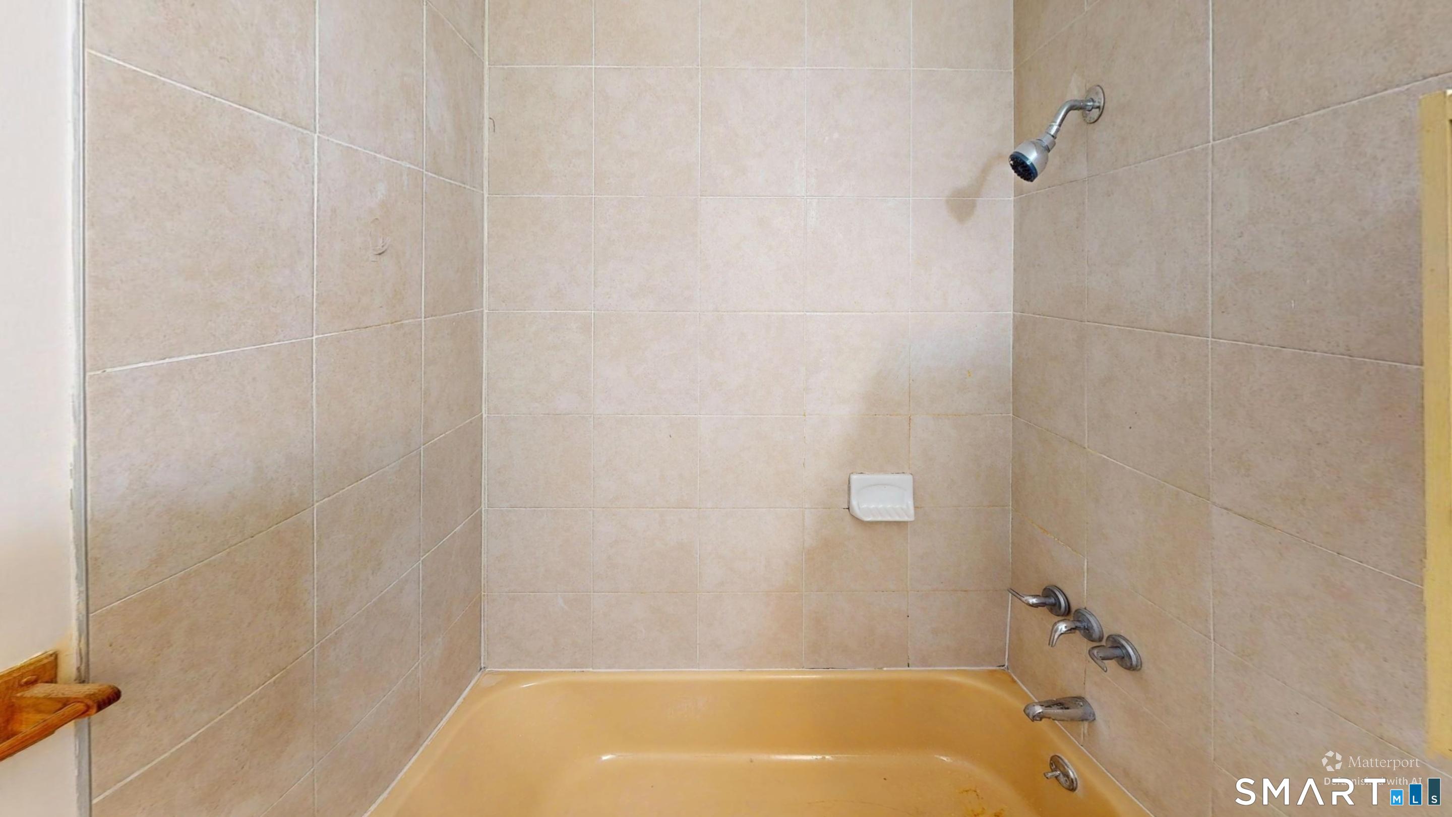 158 High Path Road, Unit 158 Windsor, CT 06095 - Photo 12 of 20 a bathroom with a bathtub