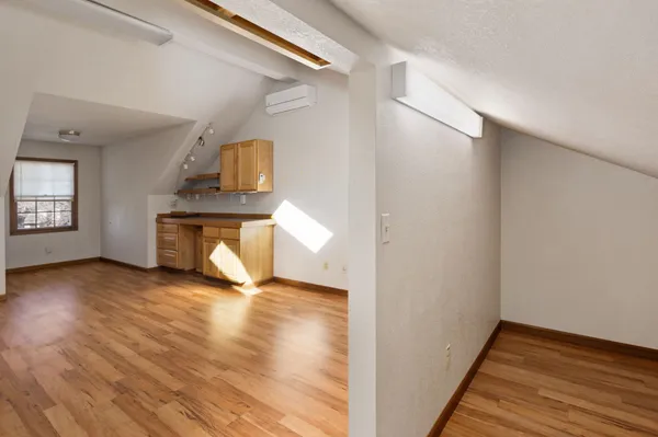 a view of a house with large windows and a yard