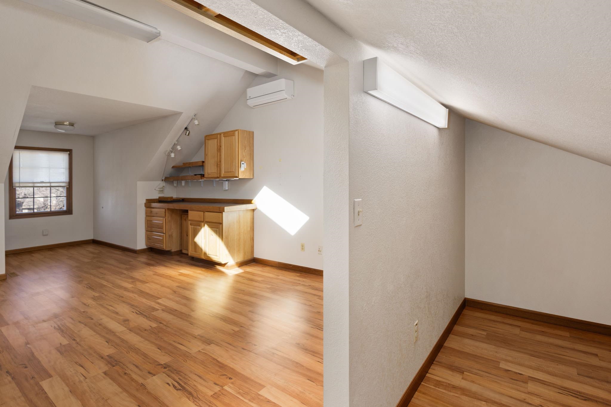1331 Ruby Way Longmont, CO 80504 - Photo 13 of 42 a view of empty room with wooden floor and fan