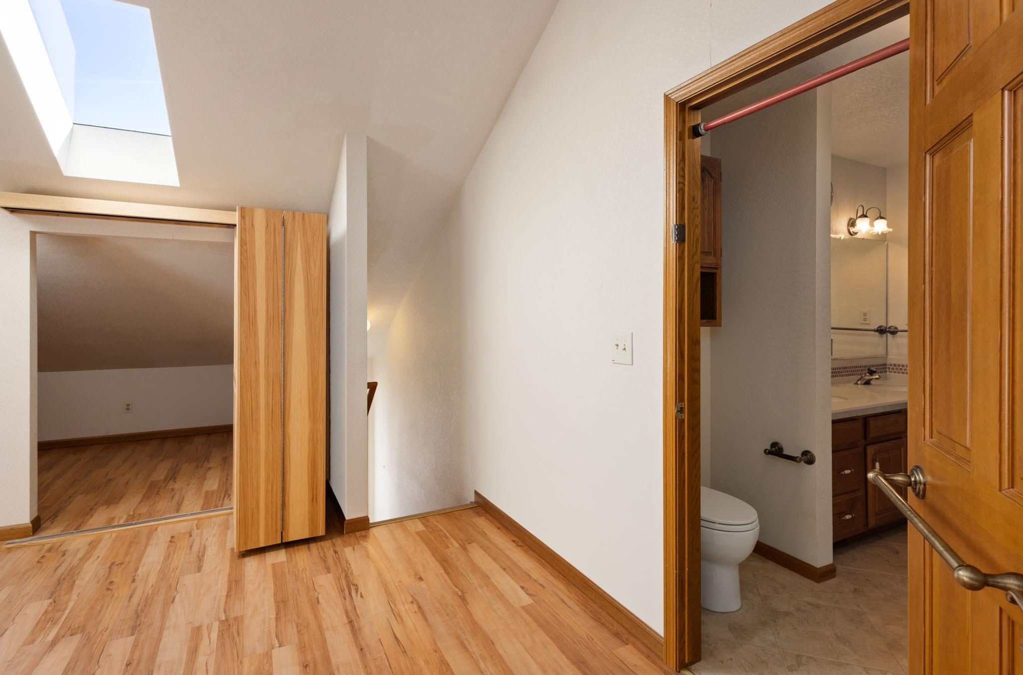 1331 Ruby Way Longmont, CO 80504 - Photo 14 of 42 a view of a room with wooden floor and closet