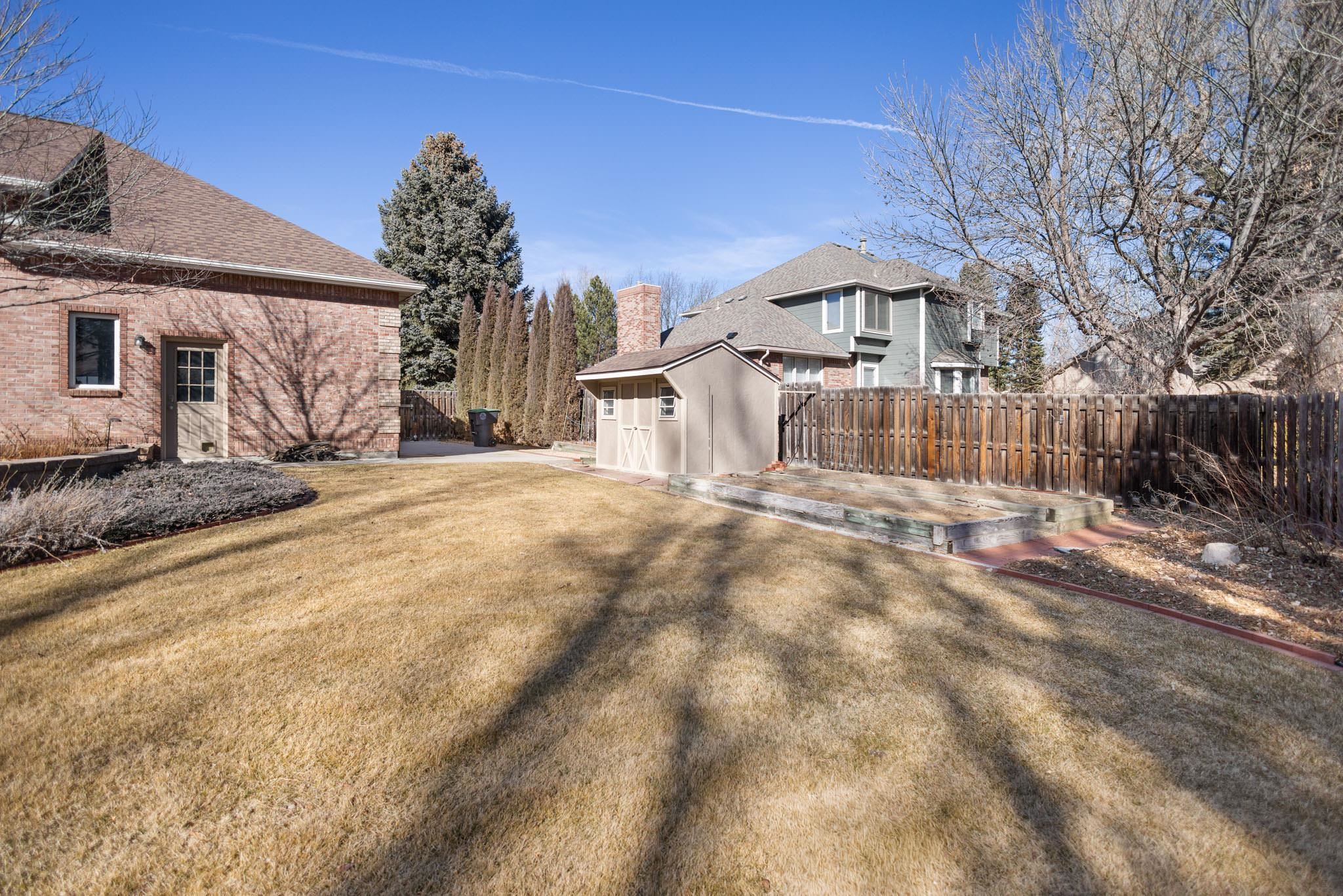 1331 Ruby Way Longmont, CO 80504 - Photo 27 of 42 a front view of a house with a yard