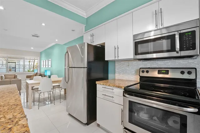 a kitchen with a stove and a microwave