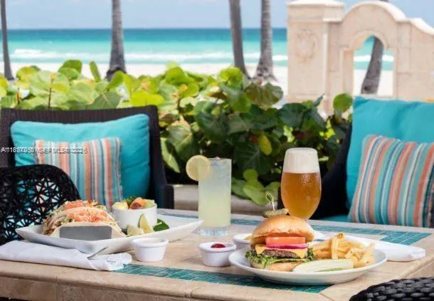 a view of a cafe with a lot of chairs and a table in the patio
