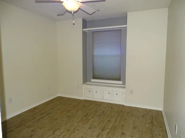 an empty room with a empty space and a window