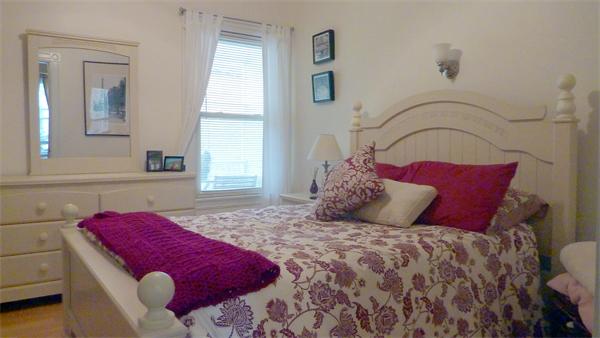 14 Linden Street, Unit 2 Brookline, MA 02445 - Photo 11 of 16 a bedroom with a bed and a dresser