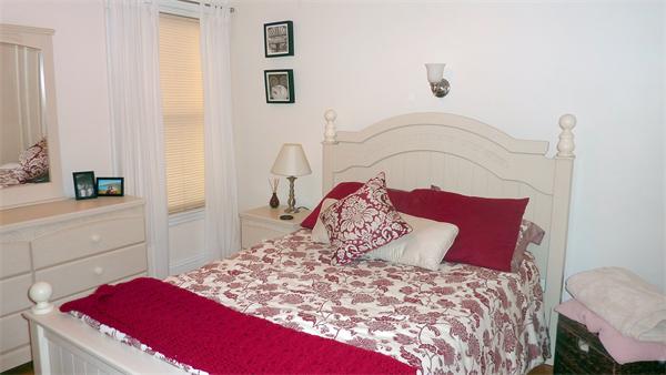 14 Linden Street, Unit 2 Brookline, MA 02445 - Photo 12 of 16 a bedroom with a bed and a dresser