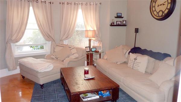 14 Linden Street, Unit 2 Brookline, MA 02445 - Photo 3 of 16 a living room with furniture and a large window