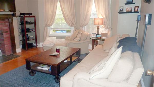 14 Linden Street, Unit 2 Brookline, MA 02445 - Photo 4 of 16 a living room with furniture and a window