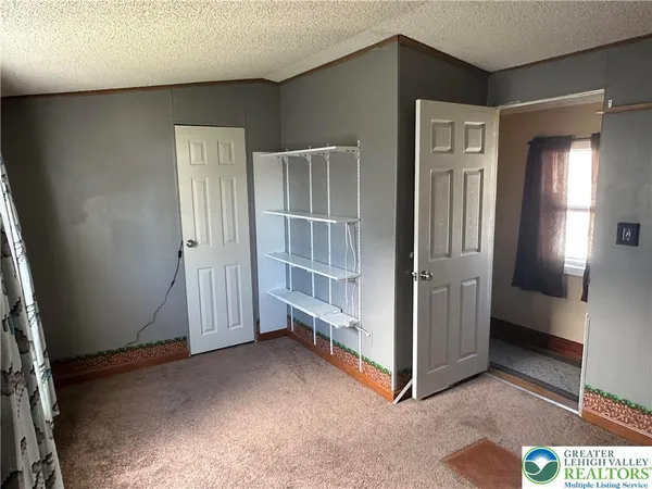 a wooden door in front of a house