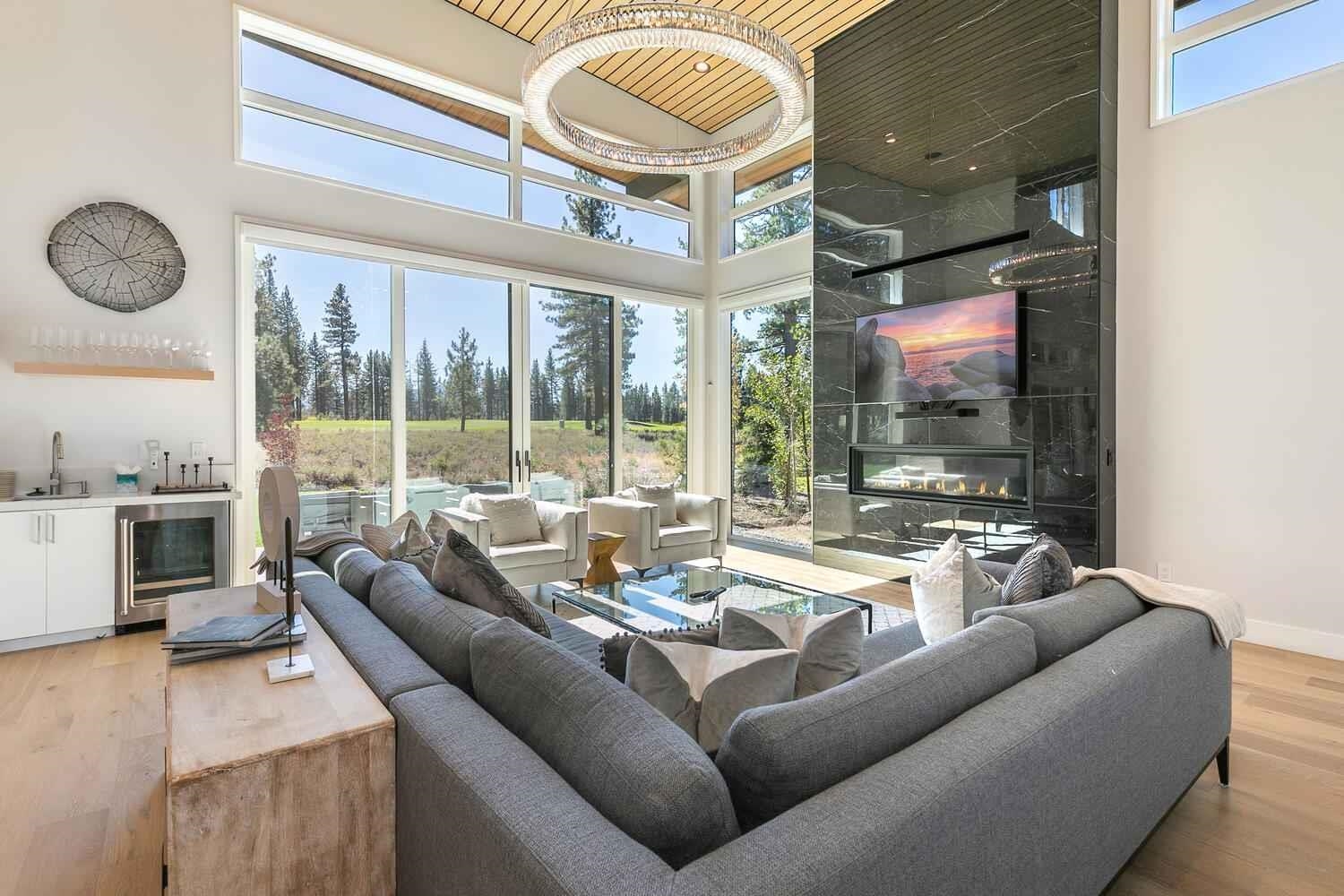 11614 Henness Road Truckee, CA 96161 - Photo 2 of 21 a living room with furniture and a floor to ceiling window