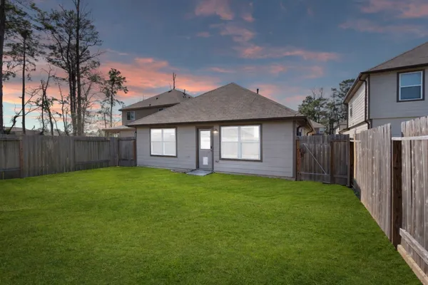 a aerial view of a house with a tree