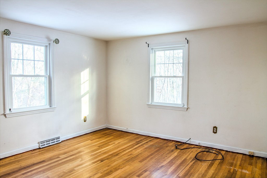 47 Amble Road Chelmsford, MA 01824 - Photo 14 of 30 an empty room with wooden floor and windows