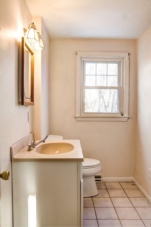 47 Amble Road Chelmsford, MA 01824 - Photo 17 of 30 a bathroom with a sink a toilet and a mirror