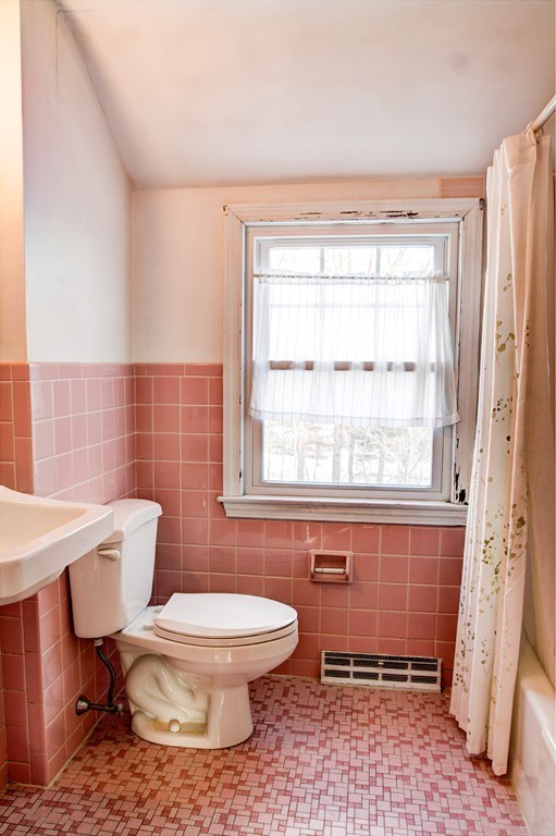 47 Amble Road Chelmsford, MA 01824 - Photo 18 of 30 a bathroom with a toilet a sink and a window