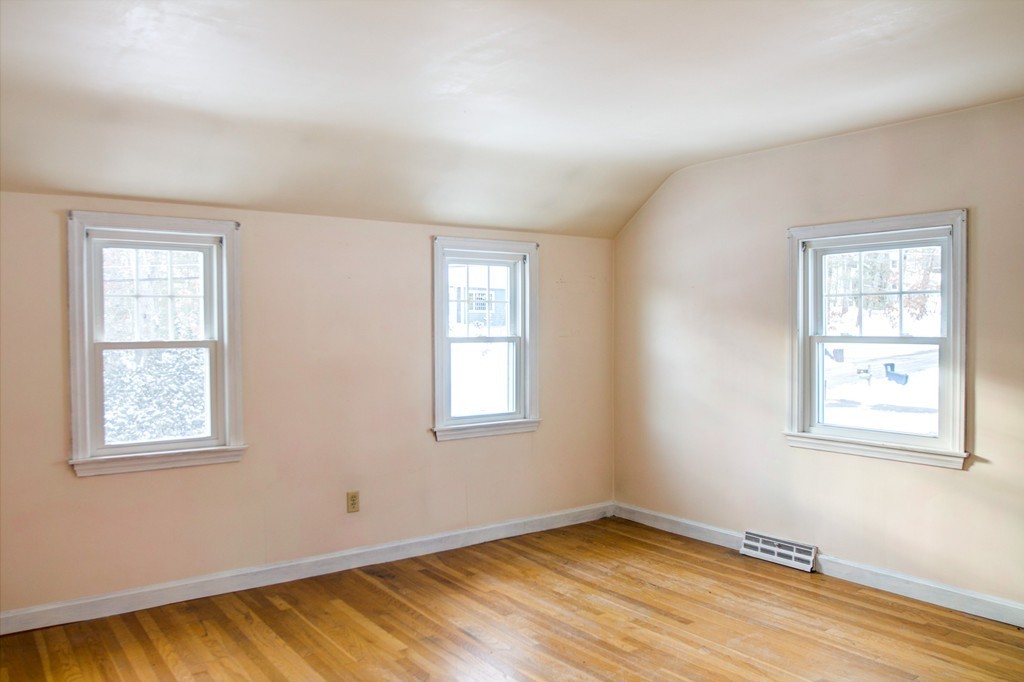 47 Amble Road Chelmsford, MA 01824 - Photo 23 of 30 a view of an empty room with wooden floor and a window